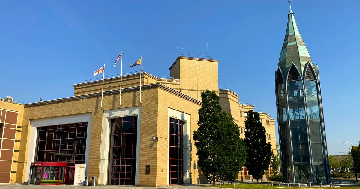 The Basildon Centre, the council's headquarters building in St Martin's Square, Basildon, with the bell tower of St Martin's Church visible behind it.